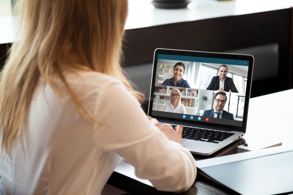 Female on web conference meeting with colleagues.